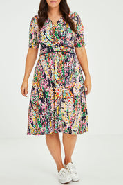 Model Laura wearing size 14 of the Printed Short Sleeve Faux Wrap Dress in colour Colourful (Blue), from the front, cropped image