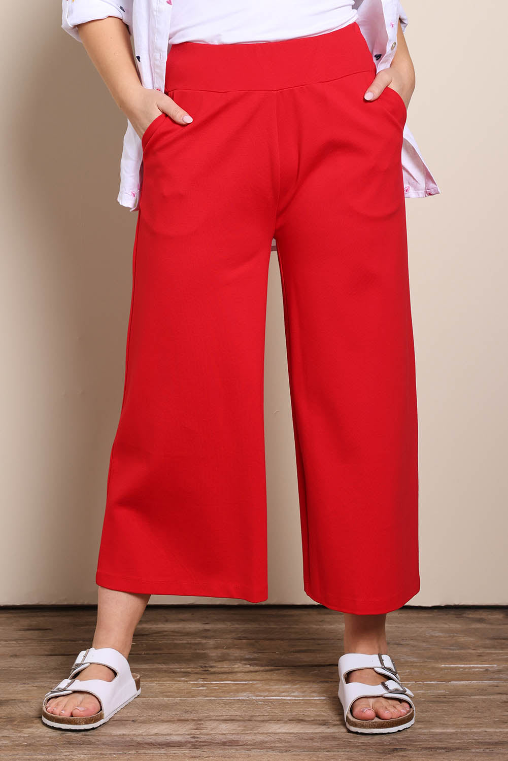 Model Georgiel wearing size 10 of the Wide Leg Ponte Pant – Brightred in colour Brightred, in a cropped view