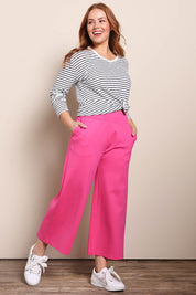 Model Georgiel wearing size 10 of the Wide Leg Ponte Pant – Pink in colour Pink, from the front
