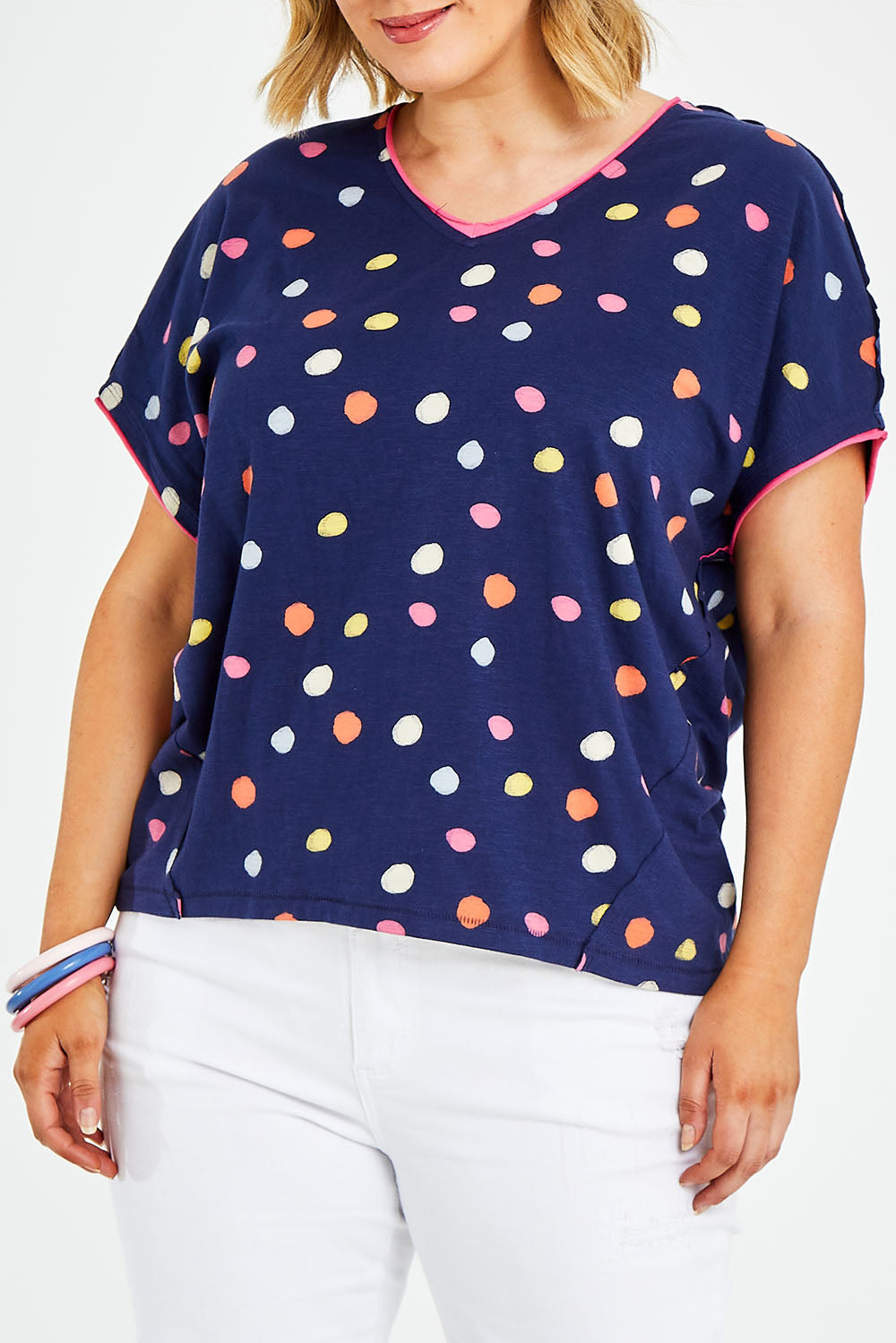 Model Jess wearing size 14 of the Multi Spot Tee in colour Multispot (Blue), from the front, cropped image