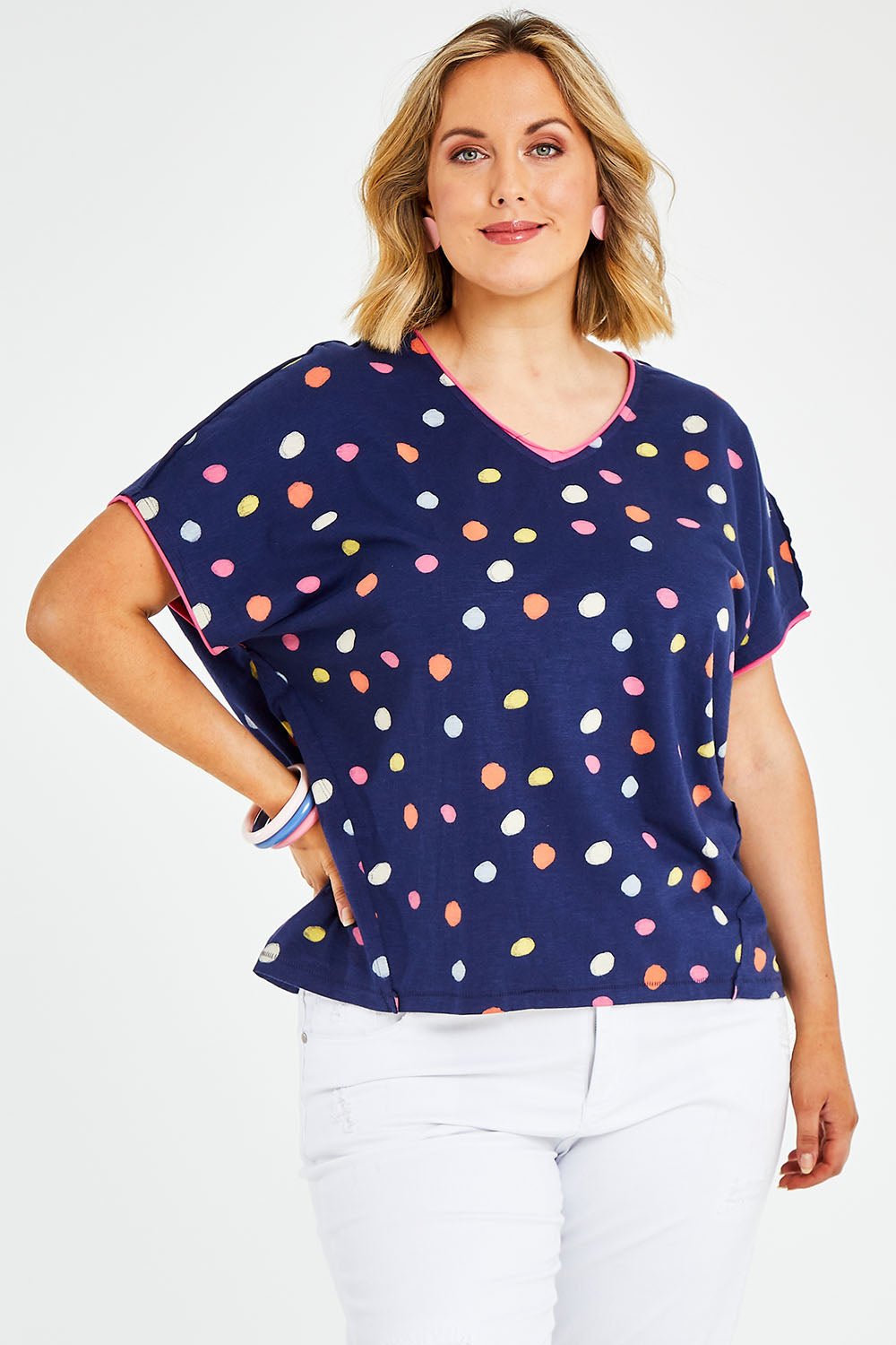 Model Jess wearing size 14 of the Multi Spot Tee in colour Multispot (Blue), from the front, cropped image