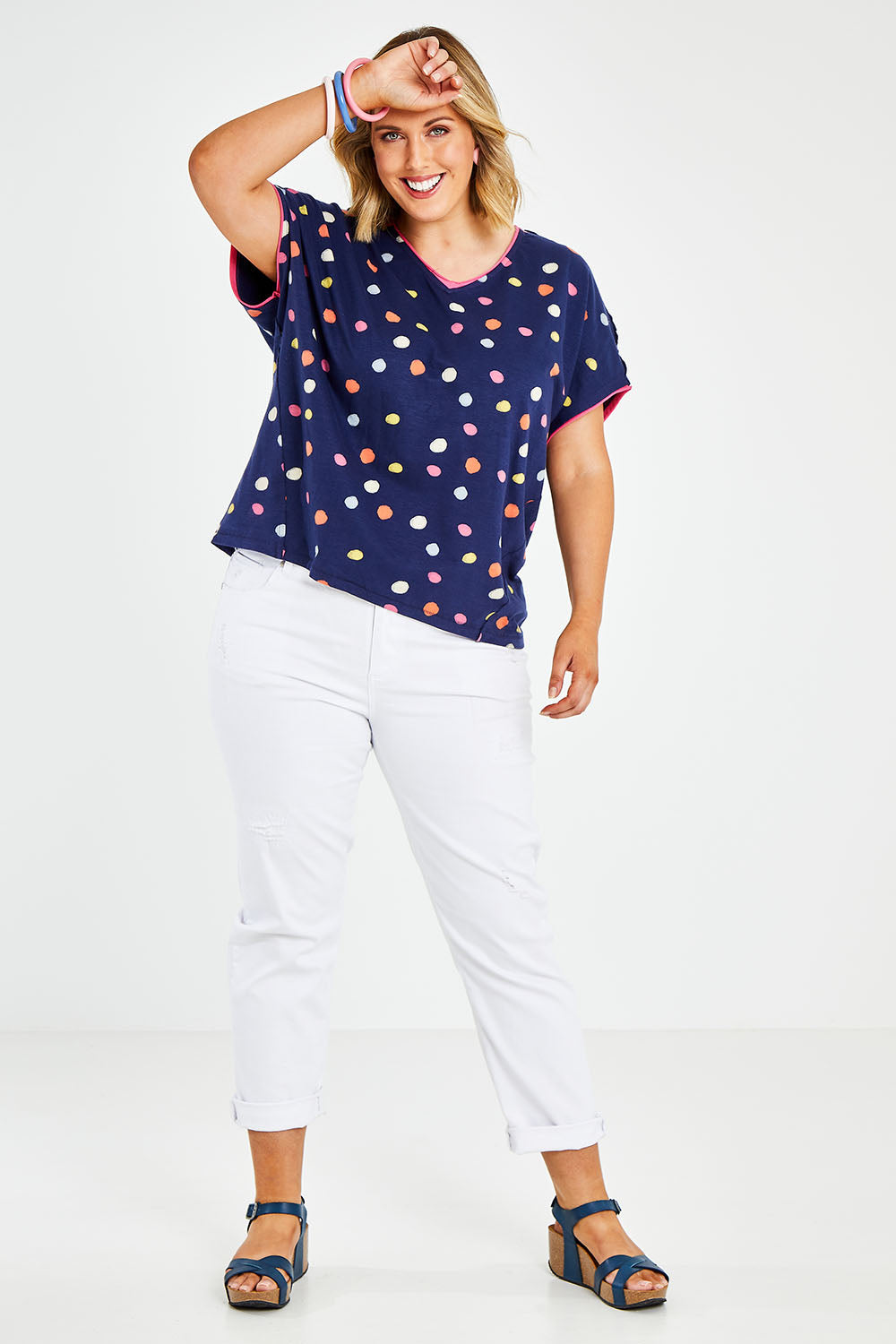 Model Jess wearing size 14 of the Multi Spot Tee in colour Multispot (Blue), from the front, showing the whole outfit