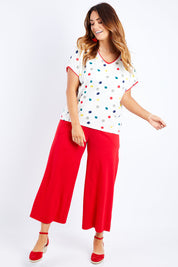 Model Laura wearing size 14 of the Multi Spot Tee in colour Multispot (White), from the front, showing the whole outfit