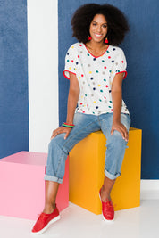 Model Schanez wearing size 10 of the Multi Spot Tee in colour Multispot (White), from the front, showing the whole outfit