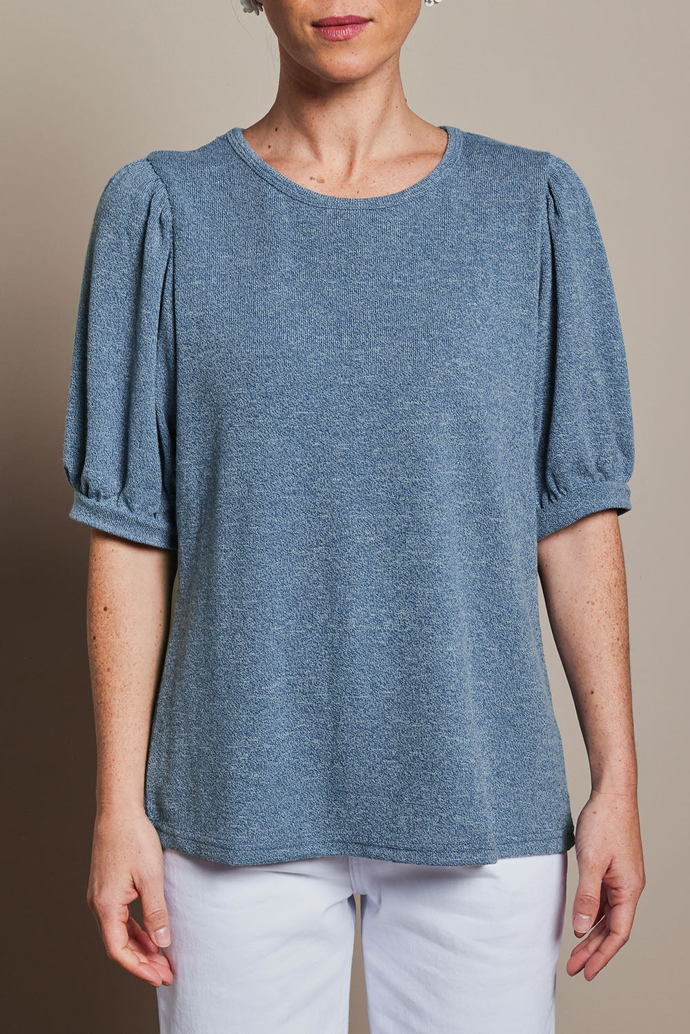 Model Katie wearing size 10 of the Gathered Sleeve Top in colour Denim (Blue), from the front, cropped image