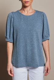 Model Katie wearing size 10 of the Gathered Sleeve Top in colour Denim (Blue), from the front, cropped image