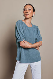 Model Katie wearing size 10 of the Gathered Sleeve Top in colour Denim (Blue), from the front, cropped image