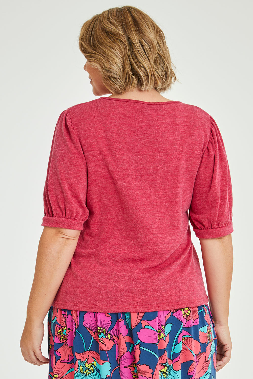 Model Fiona wearing size 16 of the Gathered Sleeve Top in colour Hotpink (Pink), from the back