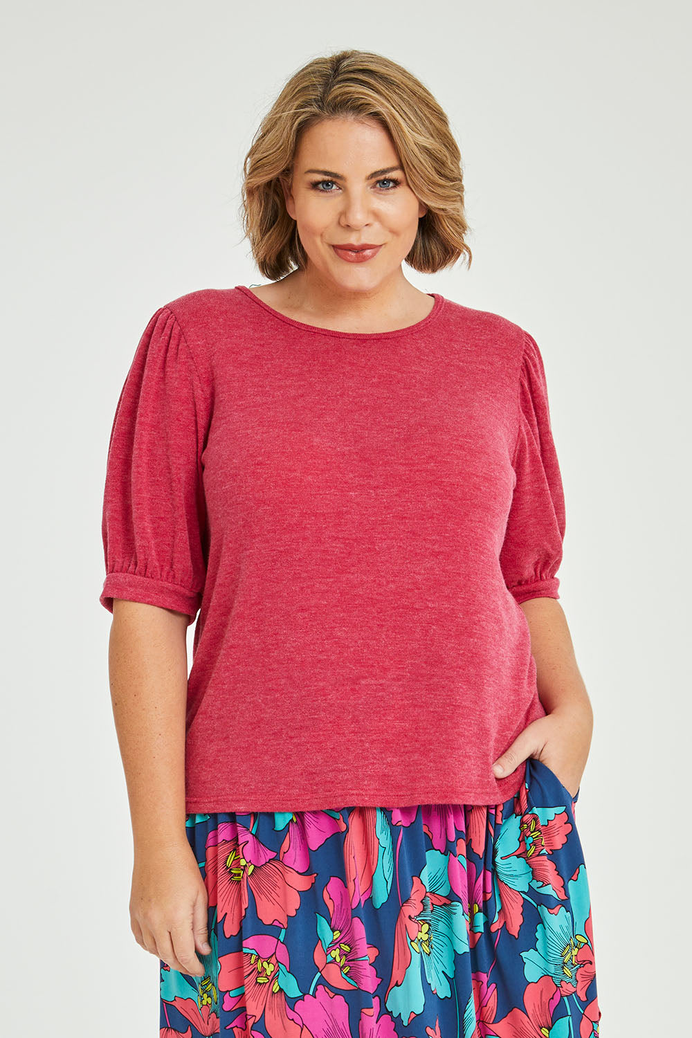Model Fiona wearing size 16 of the Gathered Sleeve Top in colour Hotpink (Pink), from the front, cropped image