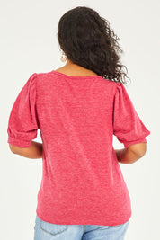 Model Terri-Leigh wearing size 14 of the Gathered Sleeve Top in colour Hotpink (Pink), from the back