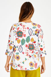 Model Laura wearing size 14 of the Printed 3/4 Sleeve High Low Hem Top in colour Flora (White), from the back