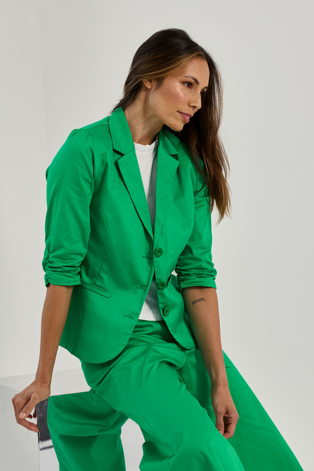 Model Amanda wearing size 10 of the Buttoned Blazer in colour Emerald (Green), from the front, showing the whole outfit