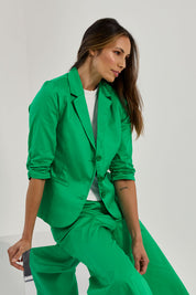 Model Amanda wearing size 10 of the Buttoned Blazer in colour Emerald (Green), from the front, showing the whole outfit