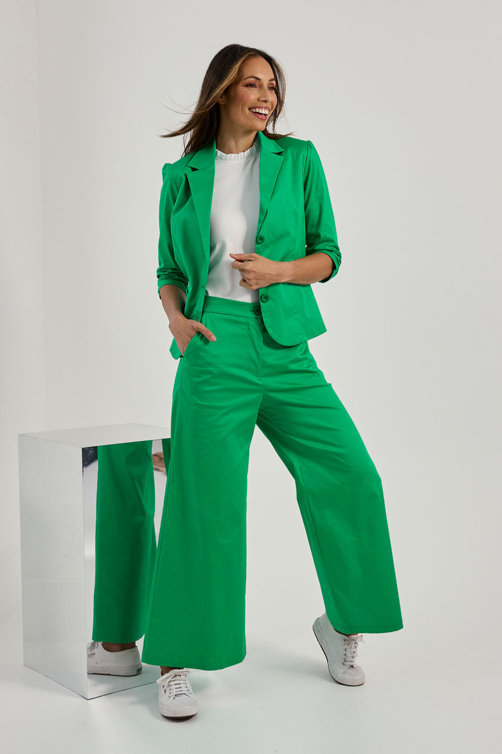 Model Amanda wearing size 10 of the Buttoned Blazer in colour Emerald (Green), from the front, showing the whole outfit