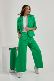 Model Amanda wearing size 10 of the Buttoned Blazer in colour Emerald (Green), from the front, showing the whole outfit