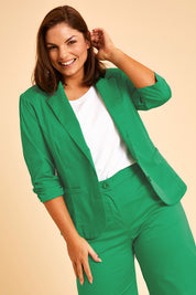 Model Monique wearing size 14 of the Buttoned Blazer in colour Emerald (Green), from the front, showing the whole outfit