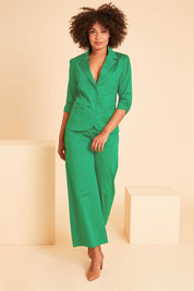 Model Olivia wearing size 10 of the Buttoned Blazer in colour Emerald (Green), from the front, showing the whole outfit