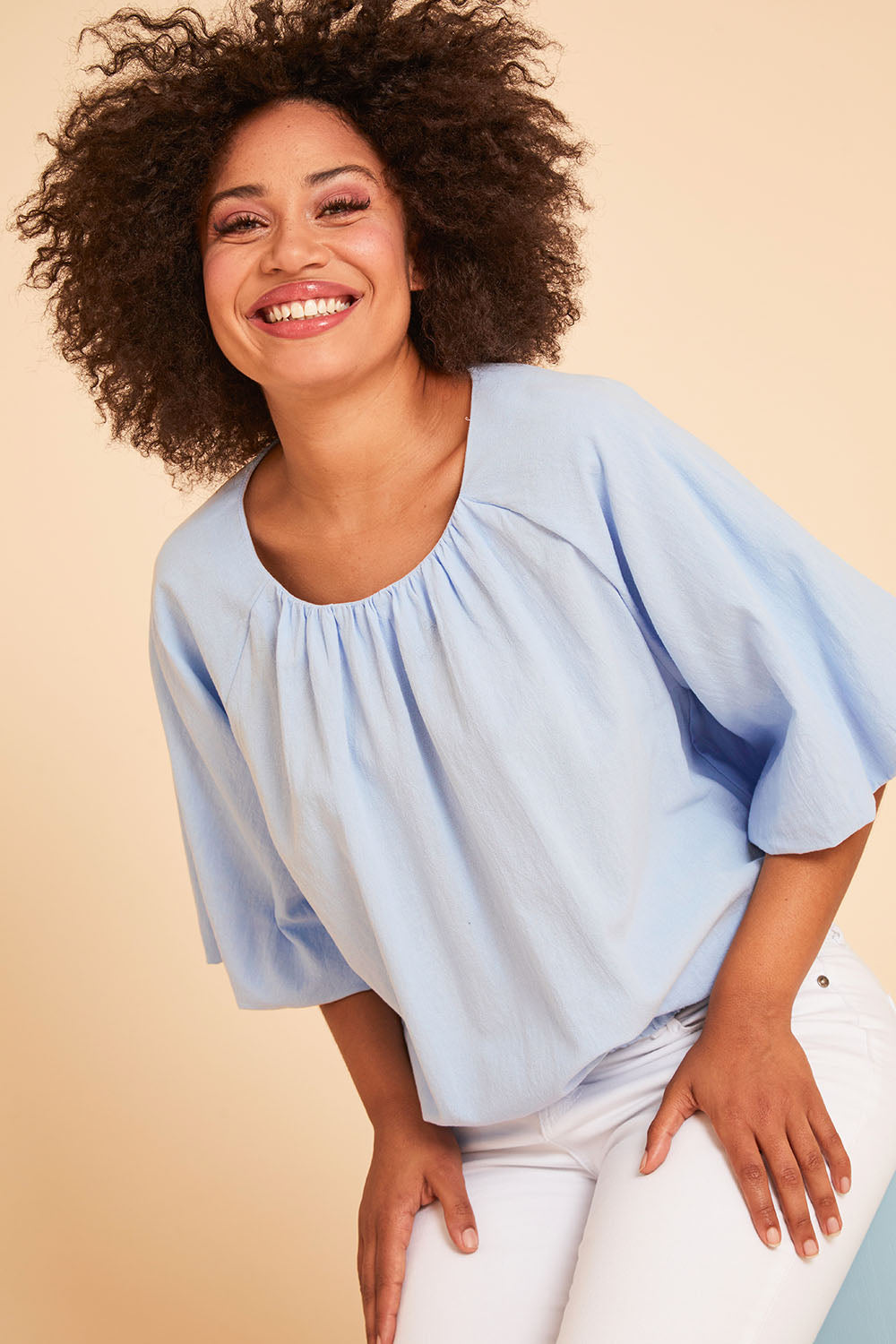 Model Olivia wearing size 10 of the Billow Sleeve Top in colour Blue (Blue), from the front, showing the whole outfit