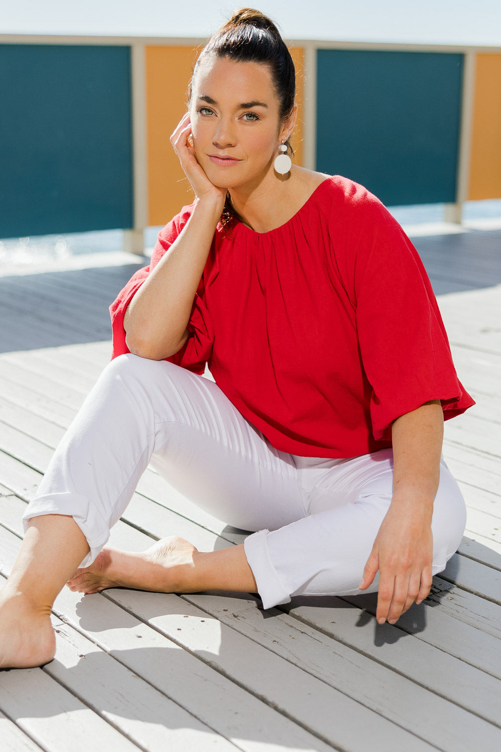 Model Laura wearing size 14 of the Billow Sleeve Top in colour Red (Red), from the front, showing the whole outfit