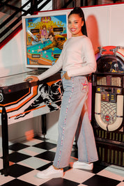 Model Olivia wearing size 10 of the Patch Denim High Waisted Jeans in colour Denim (Blue), from the front, showing the whole outfit