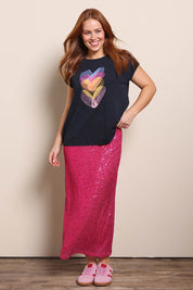 Model Georgiel wearing size 10 of the Heart Logo Tee – Blackpink in colour Blackpink, from the front