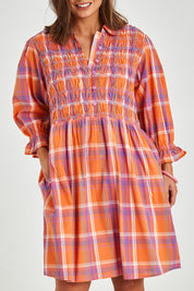 Model Monique wearing size 14 of the Shirred Bodice Detail Dress in colour Checked, from the front, cropped image