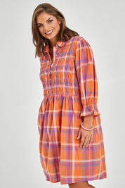 Model Monique wearing size 14 of the Shirred Bodice Detail Dress in colour Checked, from the front, cropped image