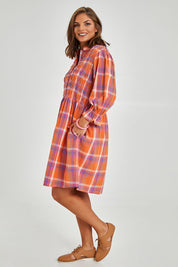 Model Monique wearing size 14 of the Shirred Bodice Detail Dress in colour Checked, from the front, showing the whole outfit
