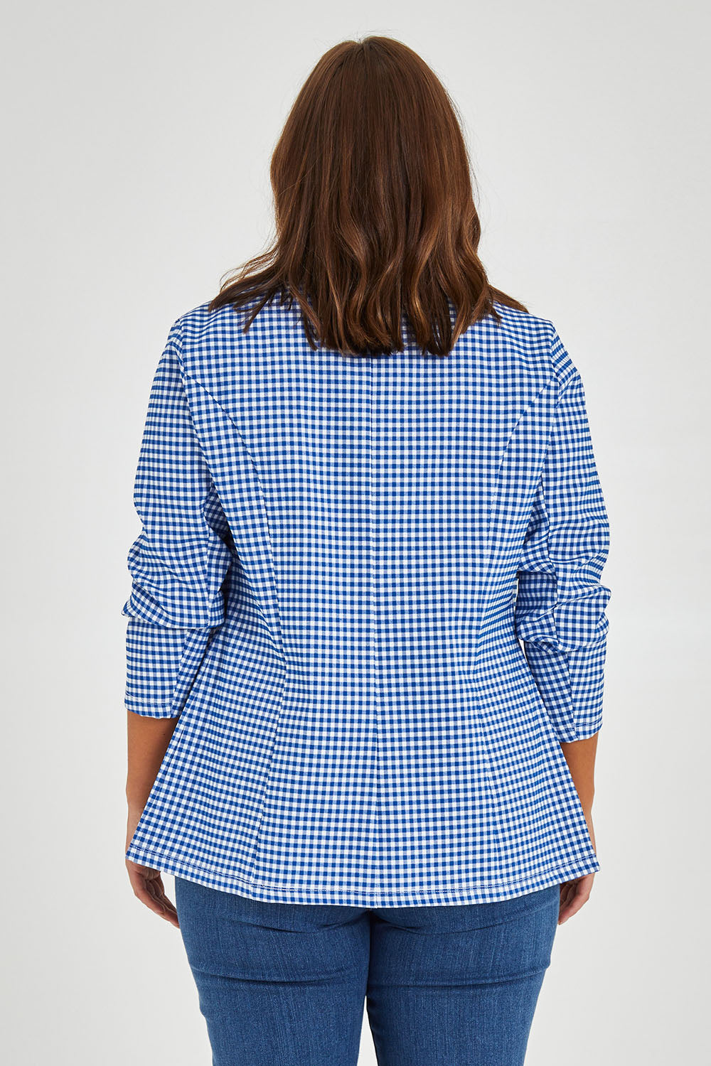 Model Monique wearing size 14 of the Long Line Blazer in colour Bluecheck (Blue), from the back