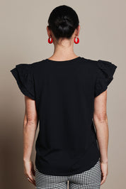 Model Katie wearing size 10 of the Ruffle Sleeve Top in colour Black (Black), from the back