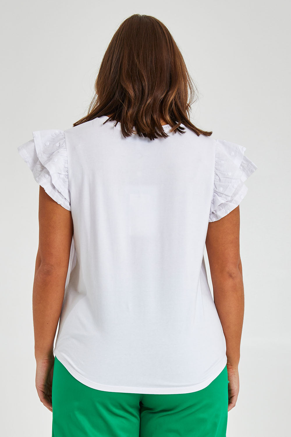 Model Monique wearing size 14 of the Ruffle Sleeve Top in colour White (White), from the back