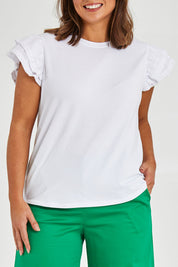 Model Monique wearing size 14 of the Ruffle Sleeve Top in colour White (White), from the front, cropped image