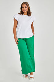 Model Monique wearing size 14 of the Ruffle Sleeve Top in colour White (White), from the front, showing the whole outfit