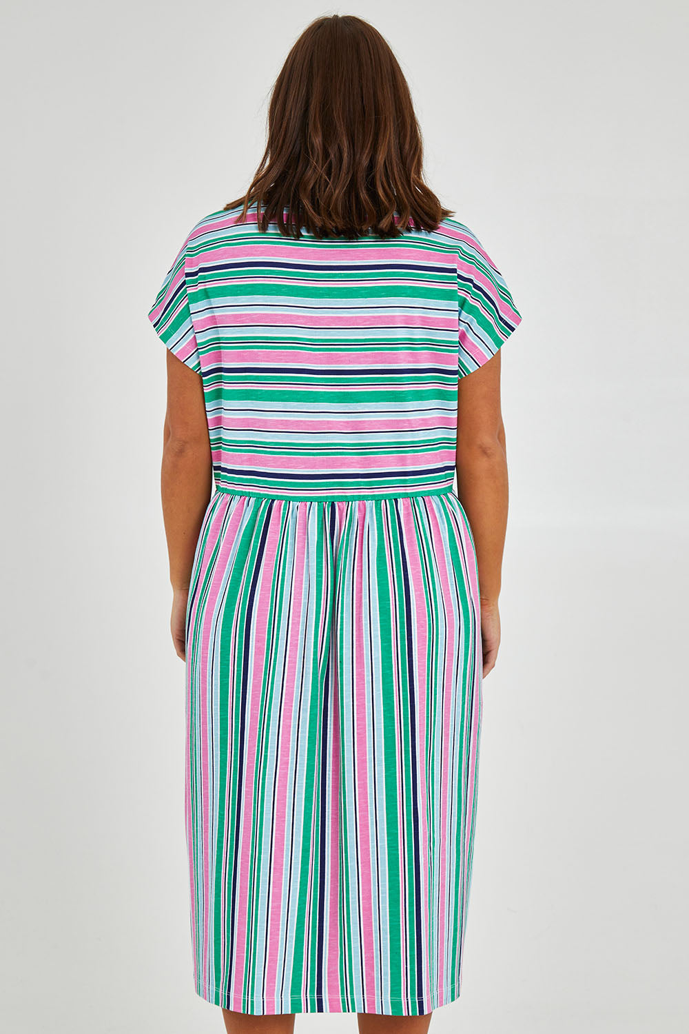 Model Monique wearing size 14 of the Stripe Slouch Dress in colour Striped (Green), from the back