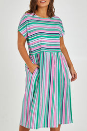Model Monique wearing size 14 of the Stripe Slouch Dress in colour Striped (Green), from the front, cropped image