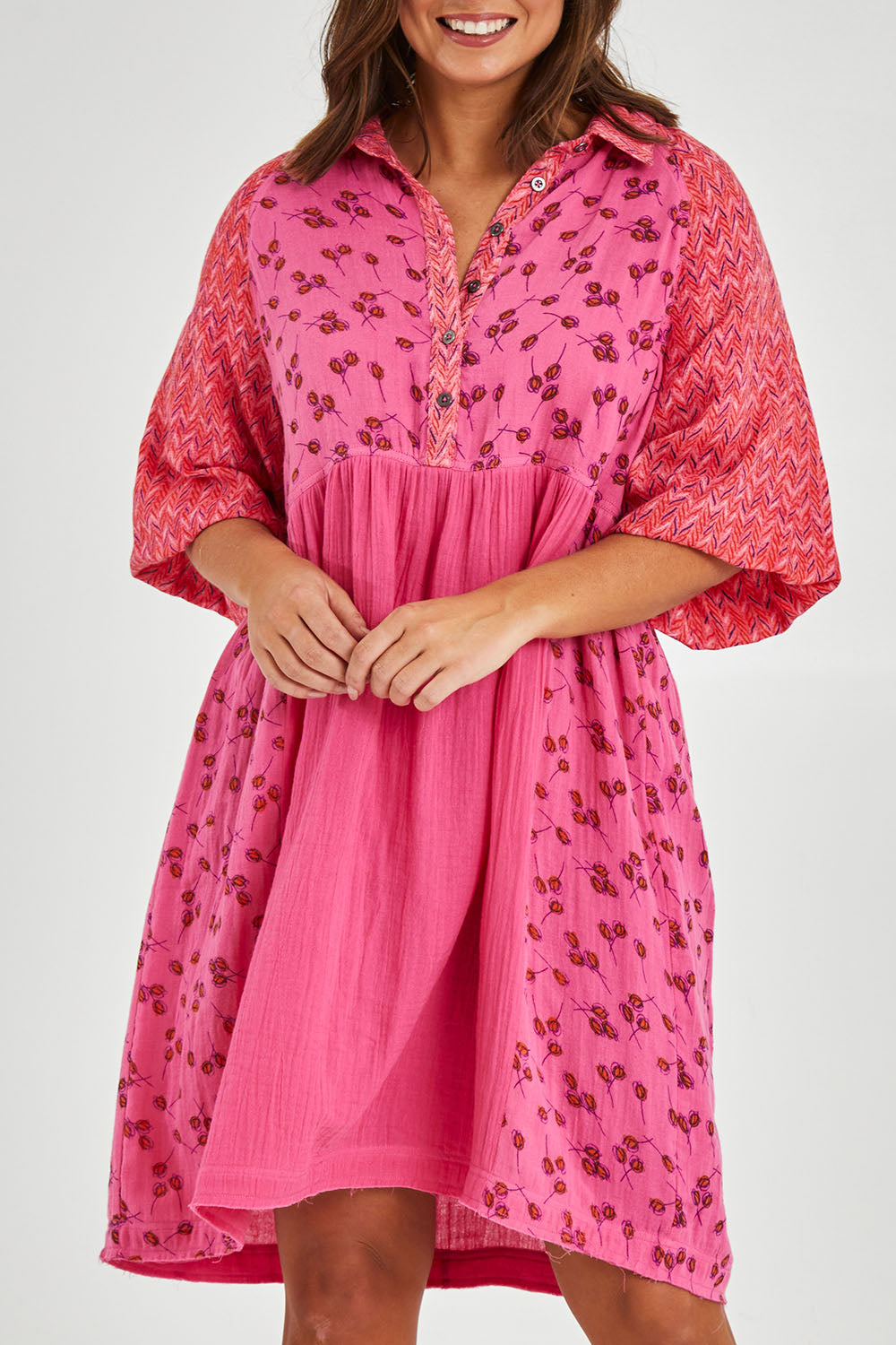 Model Monique wearing size 14 of the Bubble Sleeve Half Placket Dress in colour Mixedpink (Pink), from the front, cropped image