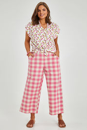 Model Monique wearing size 14 of the Wide Leg Cropped Pant in colour Pinkcheck (Pink), from the front, showing the whole outfit