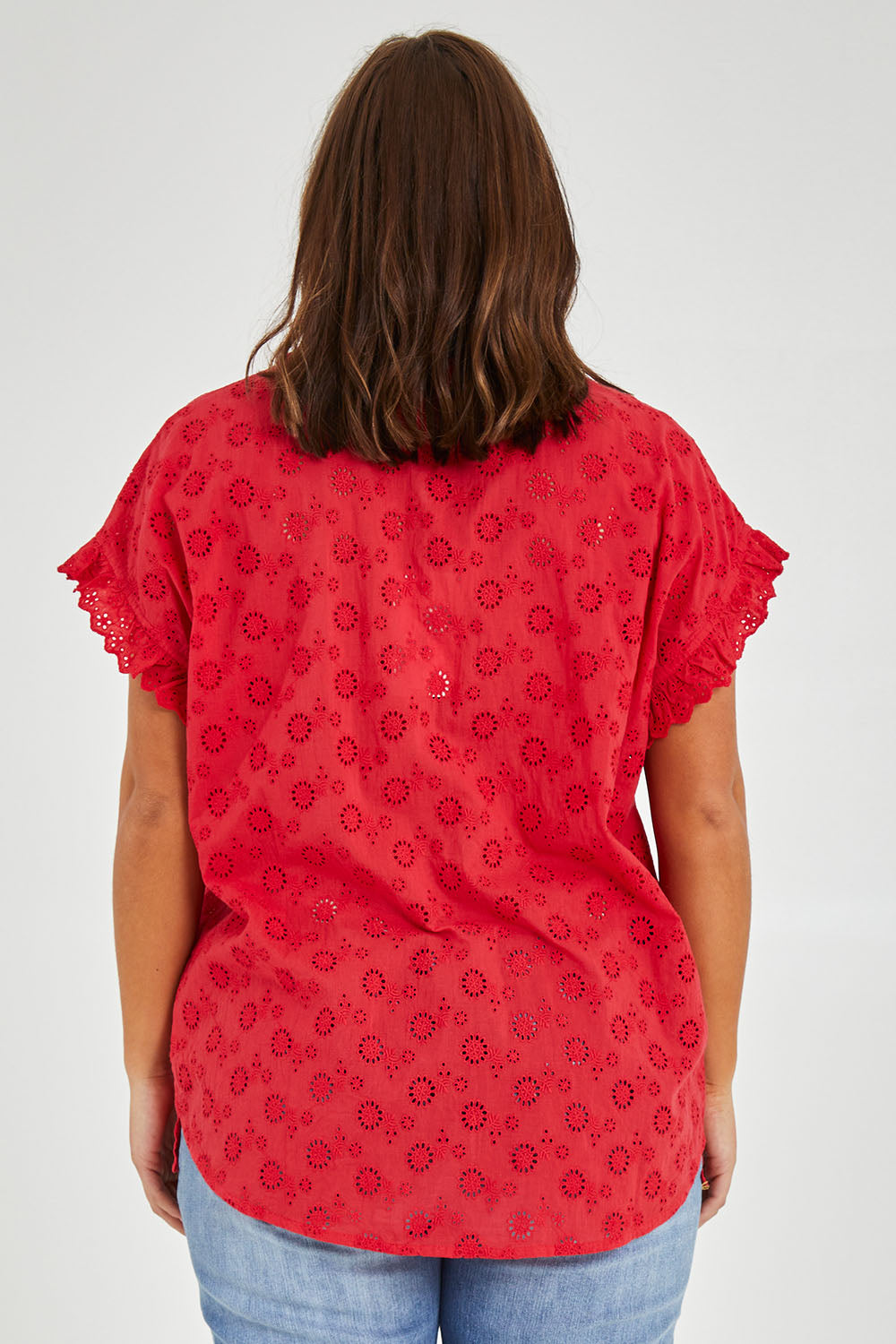Model Monique wearing size 14 of the Lace Trim Shell Top in colour Lace (Red), from the back