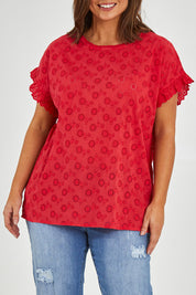 Model Monique wearing size 14 of the Lace Trim Shell Top in colour Lace (Red), from the front, cropped image