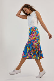 Model Amanda wearing size 10 of the Ruffle Skirt in colour Garden (Blue), from the front, showing the whole outfit