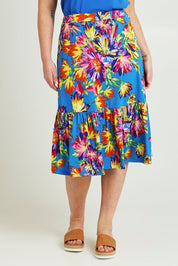 Model Jane wearing size 14 of the Ruffle Skirt in colour Garden (Blue), from the front, cropped image