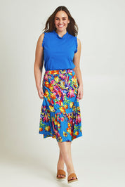 Model Jane wearing size 14 of the Ruffle Skirt in colour Garden (Blue), from the front, showing the whole outfit