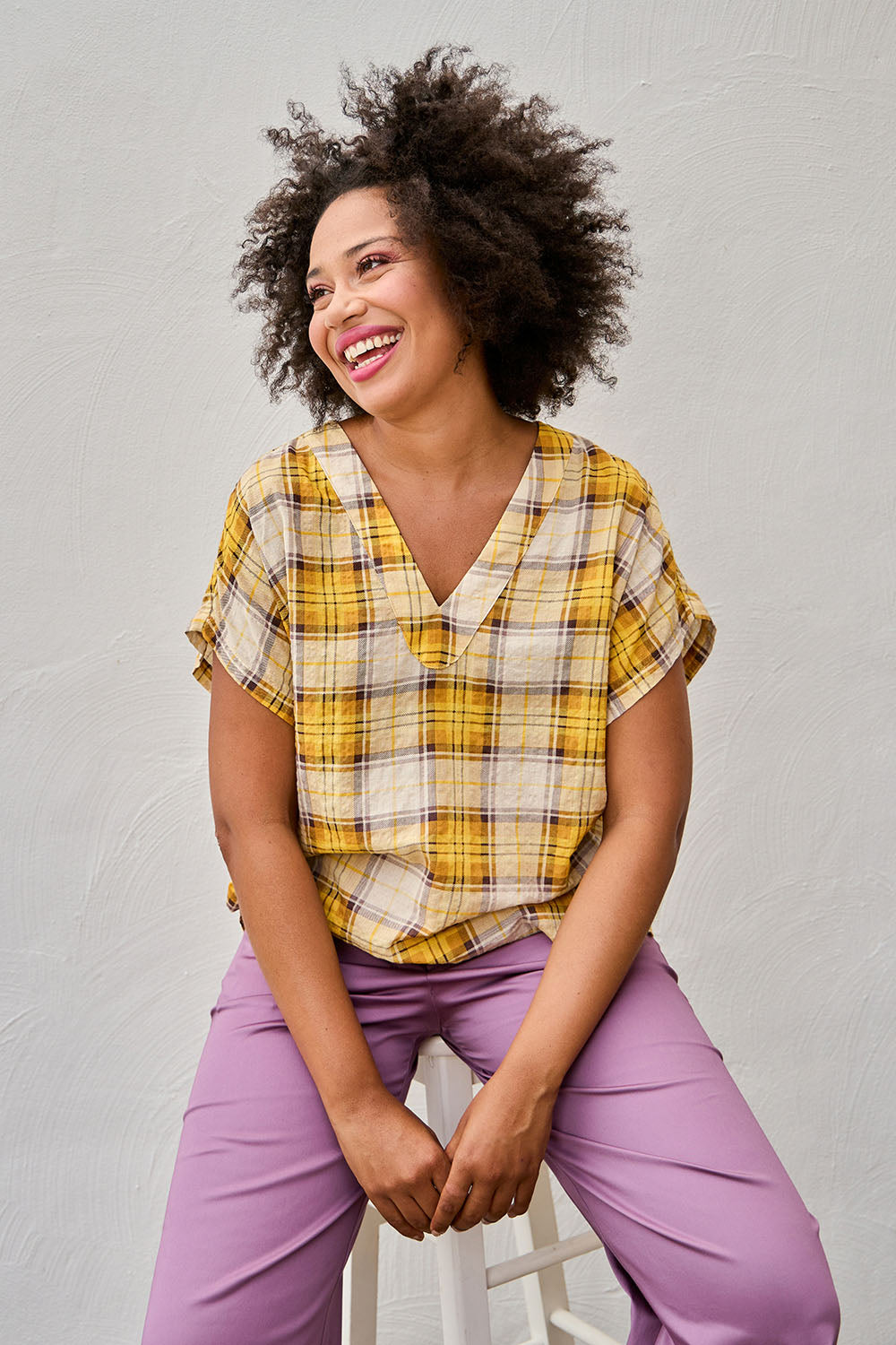 Model Olivia wearing size 10 of the V Neck Check Top in colour Citruschec, from the front, showing the whole outfit