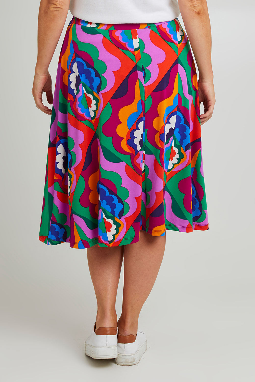 Model Laura wearing size 14 of the Elastic Waist Skirt in colour Graphic (Purple), from the back