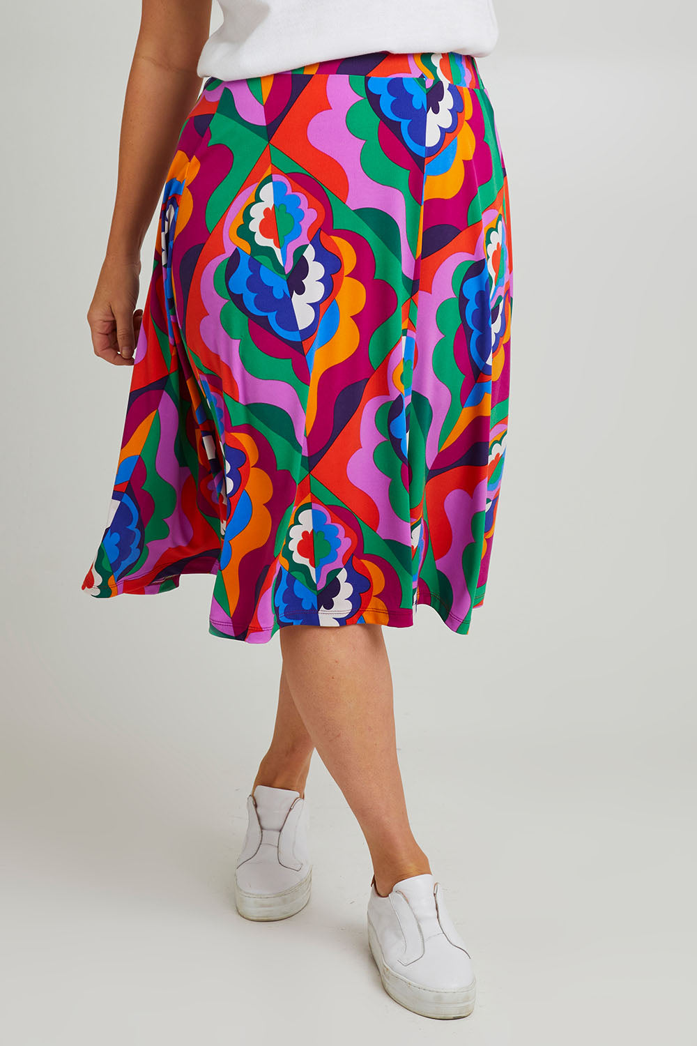 Model Laura wearing size 14 of the Elastic Waist Skirt in colour Graphic (Purple), from the front, cropped image
