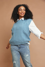 Model Ziara wearing the Cable Vest in colour Bluehaze (Blue), from the front, showing the whole outfit