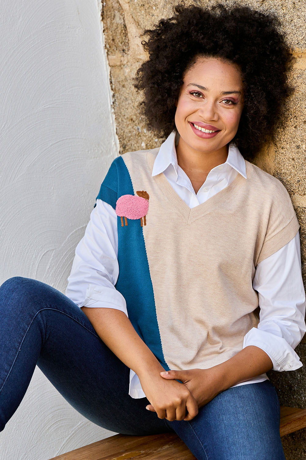 Model Olivia wearing size S of the Sheepish Vest in colour Sheepish, from the front, showing the whole outfit