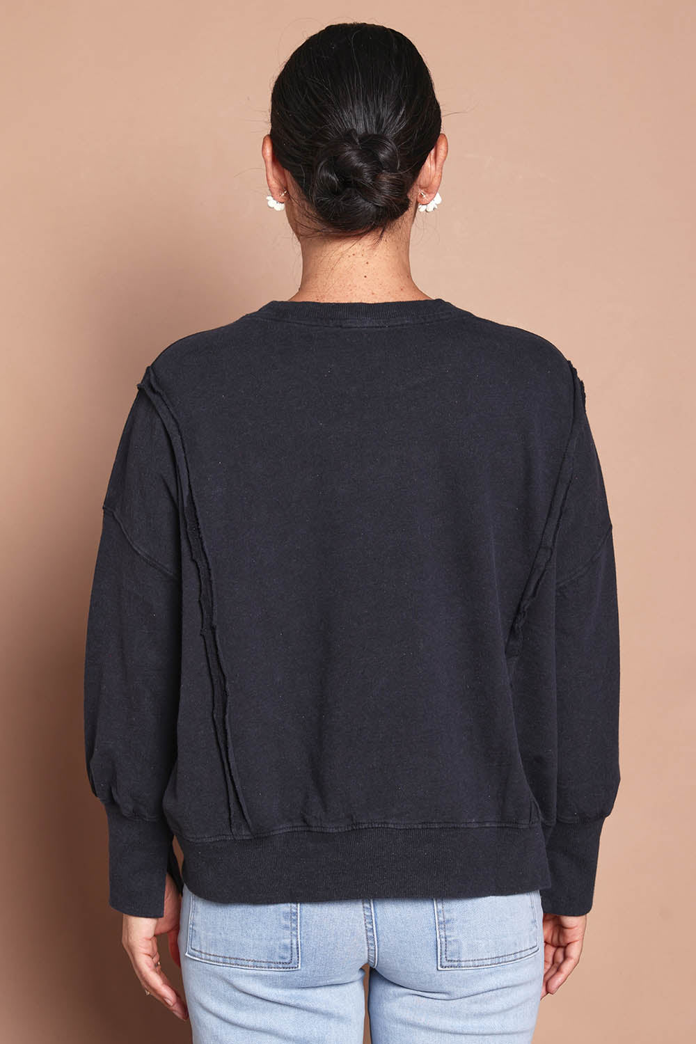 Model Katie wearing size 10 of the Heart Cotton Sweater in colour Black (Black), from the back