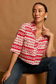 Model Katie wearing size 10 of the Relaxed Cotton Shirt in colour Abstract (Pink), from the front, showing the whole outfit