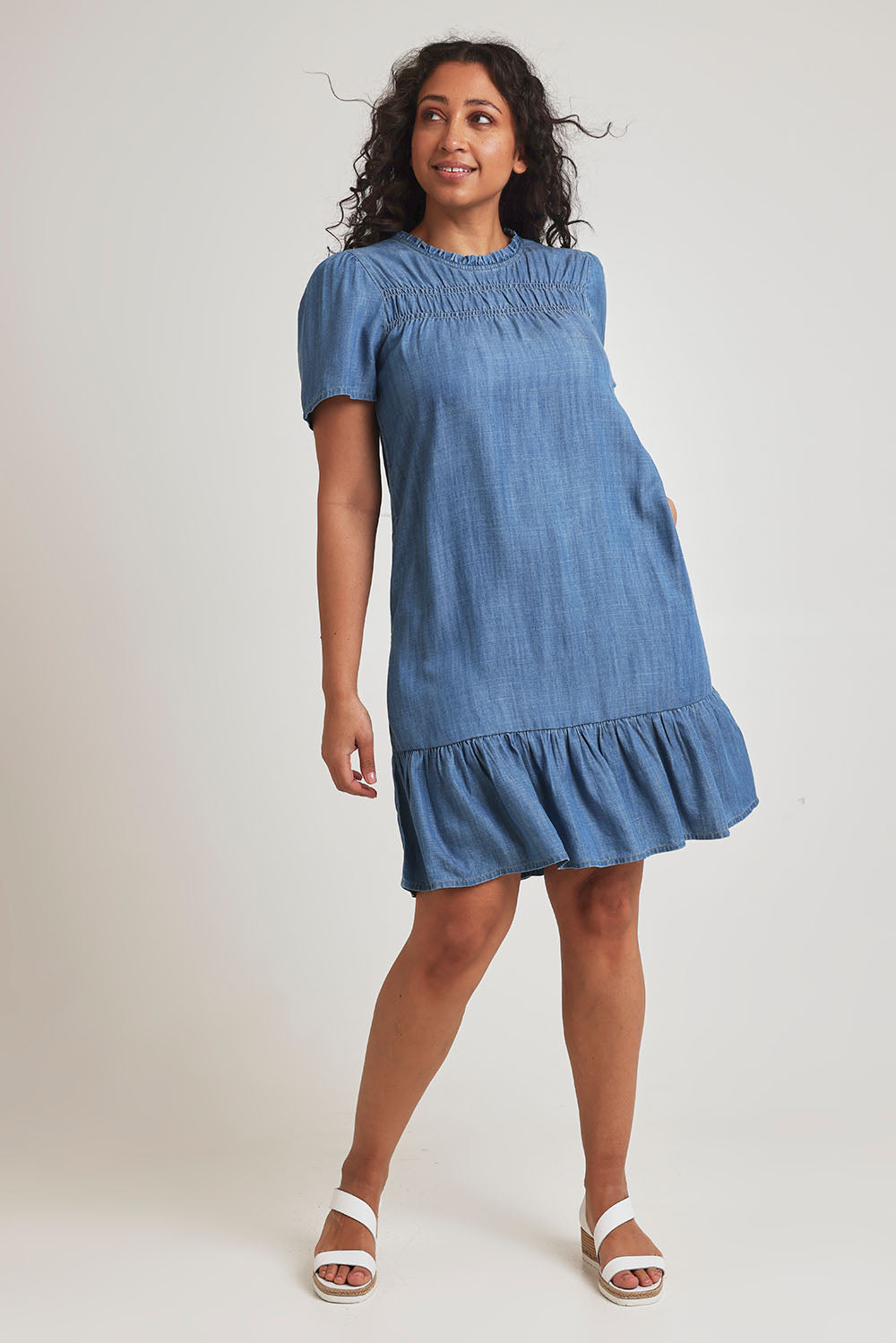 Model Terri-Leigh wearing size 14 of the Frill Hem Dress in colour Blue (Blue), from the front, showing the whole outfit